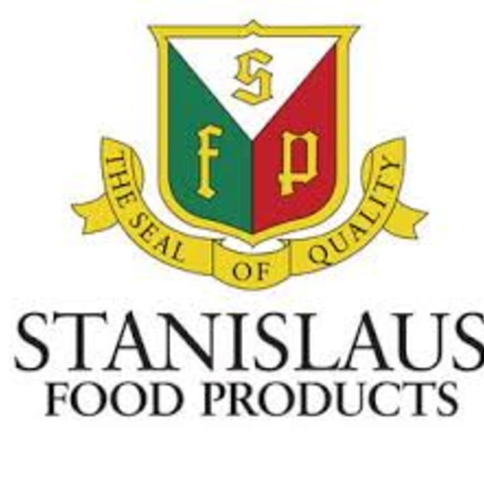 Stanislaus Food Products logo, a shield with green and red sections, and a yellow banner.